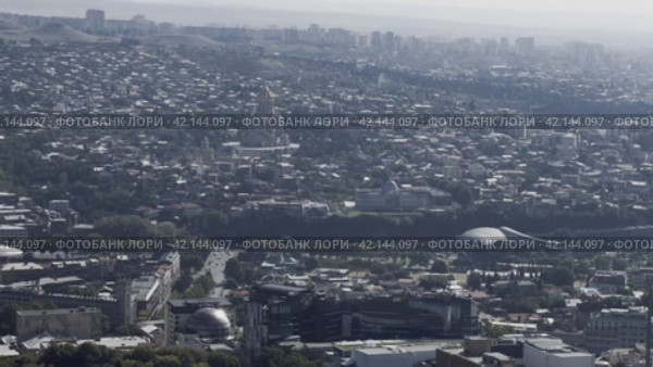 Panorama of the city center from Mtatsminda mountain. Tbilisi. Georgia. 04.09.23 (2024 год). Стоковое видео, видеограф Ярославский Максим / Фотобанк Лори