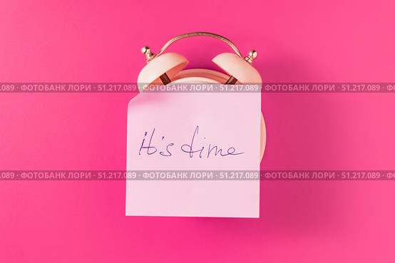 Paper sticker pasted on an old alarm clock. Стоковое фото, фотограф Siarhei Starastau / Фотобанк Лори