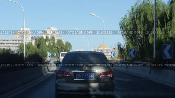 Пекин. Движение на улицах. Beijing. Traffic during the day. Streets of the city. (2018 год). Стоковое видео, видеограф Евгений Романов / Фотобанк Лори