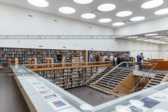 People are in main reading room of the Vyborg Library (2023 год). Редакционное фото, фотограф EugeneSergeev / Фотобанк Лори