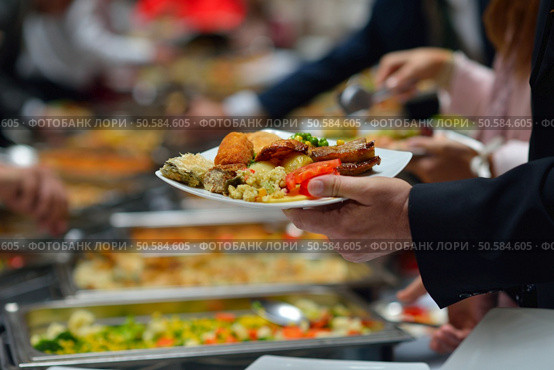 people group catering buffet food indoor in luxury restaurant with meat colorful fruits  and vegetables. Стоковое фото, агентство Ingram Publishing / Фотобанк Лори