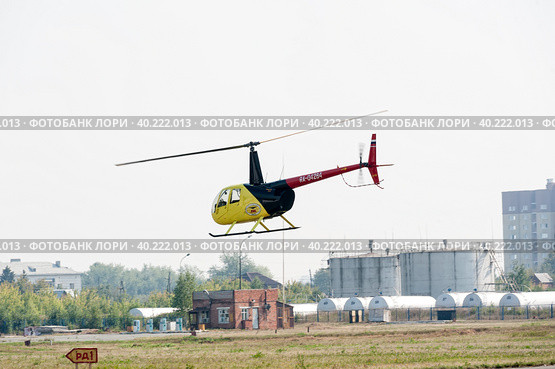 Piloting of Robinson R44 Raven on airshow (2012 год). Редакционное фото, фотограф Сергей Буторин / Фотобанк Лори