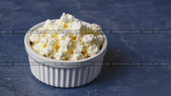 Plain curd or yogurt or Dahi in Hindi, served in a bowl over moody background. Selective focus. Стоковое AI-видео, аниматор Ирина Старикова / Фотобанк Лори