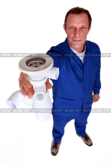 Plumber holding replacement sink plug. Стоковое фото, агентство Ingram Publishing / Фотобанк Лори