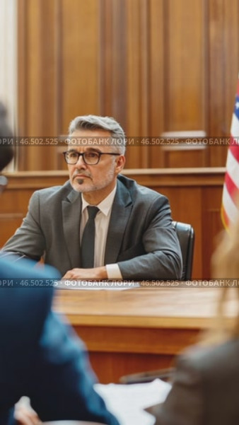 Politician sitting at table speaking at press conference. Стоковое AI-видео, аниматор Юрий Поздников / Фотобанк Лори