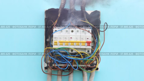 Poor electrical work led to short circuit in wiring of consumer unit and caused an electric fire. Стоковое видео, видеограф Владимир Григорьев / Фотобанк Лори
