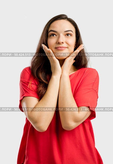 Portrait of a beautiful lovely woman with a dreaming expression. Стоковое фото, агентство Ingram Publishing / Фотобанк Лори