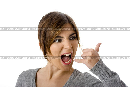 Portrait of a beautiful woman signaling for you to call her. Isolated on white. Стоковое фото, агентство Ingram Publishing / Фотобанк Лори