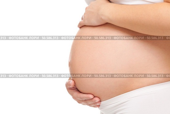 Portrait of a pregnant woman holding her belly. Стоковое фото, агентство Ingram Publishing / Фотобанк Лори