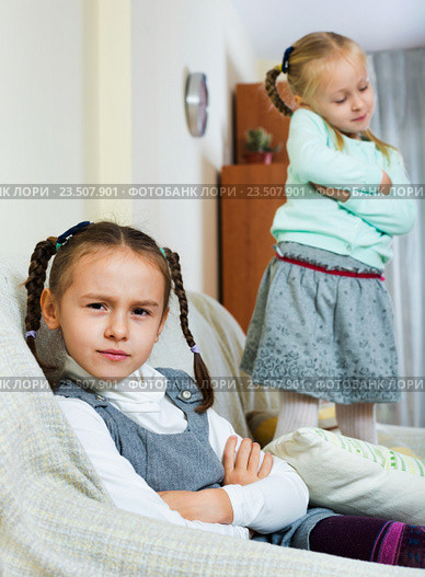 Portrait of two small miserable girls having conflict. Стоковое фото, фотограф Яков Филимонов / Фотобанк Лори