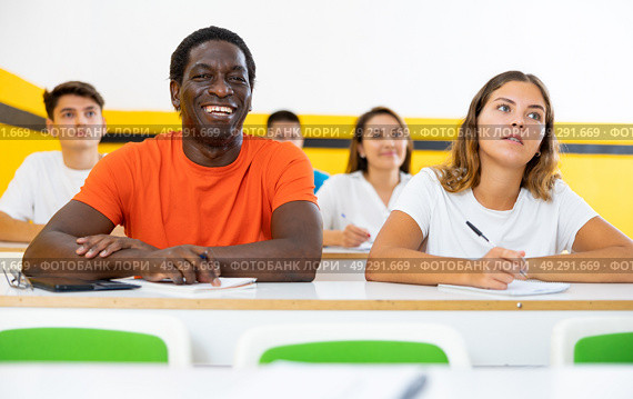 Positive man and woman studying in school for taxi drivers. Стоковое фото, фотограф Яков Филимонов / Фотобанк Лори