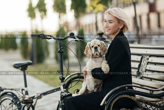 pretty woman petting her cute dog 2. Стоковое фото, агентство Ingram Publishing / Фотобанк Лори