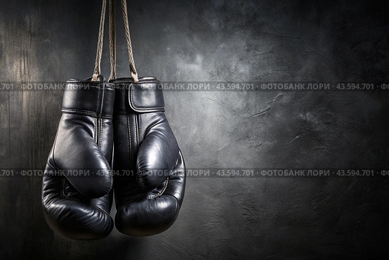 Professional black boxing gloves hang on a black background with a space to copy. Стоковое AI-изображение, AI-художник Photojuli / Фотобанк Лори