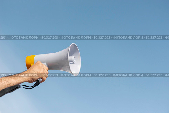 protester holding megaphone demonstration. High resolution photo. protester holding megaphone demonstration. High quality photo. Стоковое фото, агентство Ingram Publishing / Фотобанк Лори