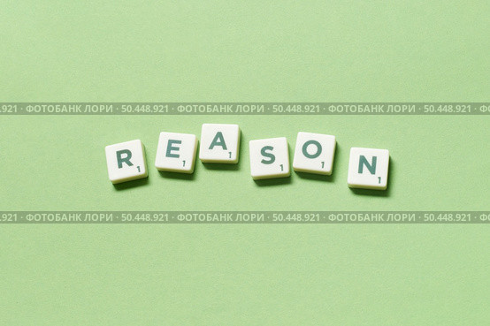 Reason word formed of scrabble tiles on green background. Creative business postcard idea in pastel palette.. Reason formed of scrabble tiles on green background. Стоковое фото, агентство Ingram Publishing / Фотобанк Лори