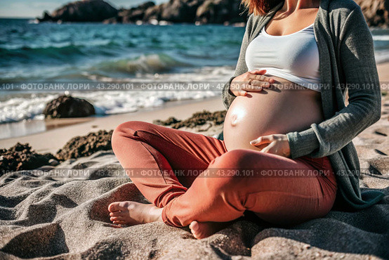 Relaxation, peace of mind, sea air. Close-up of the tummy. A pregnant woman on the beach by the sea. The concept of pregnancy, childbirth and parental responsibilities. Стоковое AI-изображение, AI-художник Photojuli / Фотобанк Лори