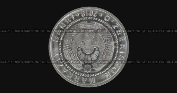 Реверс монеты Узбекистана 2018 года на черном фоне. Бесшовная анимация. Obverse of Uzbekistan coin 100, 200 and 500 so'm, isolated in black background. Seamless animation in 4k resolution video. Стоковая анимация, аниматор Александр Кузнецов / Фотобанк Лори