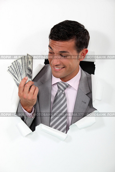 Rich businessman showing off his money. Стоковое фото, агентство Ingram Publishing / Фотобанк Лори