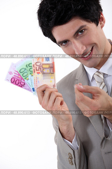 Rich businessman showing off his money. Стоковое фото, агентство Ingram Publishing / Фотобанк Лори