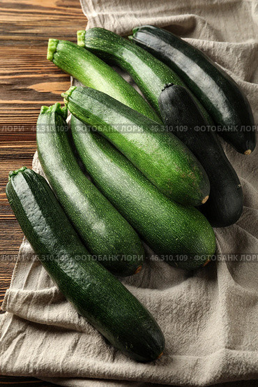 Ripe zucchinis on wooden table. Стоковое фото, фотограф Pixel_shot / Фотобанк Лори