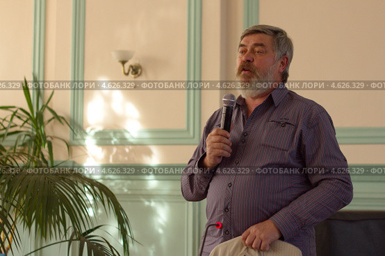 Российский писатель  Сергей Трофимович Алексеев, автор бестселлеров «Слово», «Сокровища Валькирии» на встрече с читателями (2013 год). Редакционное фото, фотограф Копосова Татьяна Геннадьевна / Фотобанк Лори
