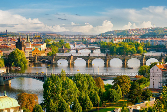 Row of bridges in Prague at summer day. Стоковое фото, агентство Ingram Publishing / Фотобанк Лори