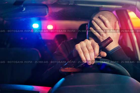 Sad man is caught driving under alcohol influence. Стоковое фото, фотограф Pavel Biryukov / Фотобанк Лори