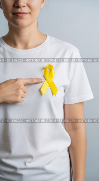 Сaucasian woman stands with a yellow ribbon on a white t-shirt, pointing at it. Стоковое AI-изображение, AI-художник Екатерина Селезнева / Фотобанк Лори