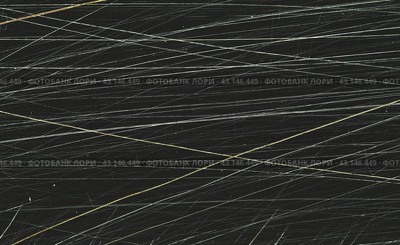 Scratched film texture. Many bright lines in different directions on a dark background. Perfect for grunge design. Стоковое фото, фотограф Андрей Степанов / Фотобанк Лори