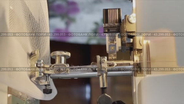 Seamstress female hands holding and stitching yellow textile fabric on modern sewing machine at workplace. Sewing process, upholstery, clothes, repair, DIY. Handmade, hobby, small business concept. Стоковое видео, видеограф Mikhail Davidovich / Фотобанк Лори
