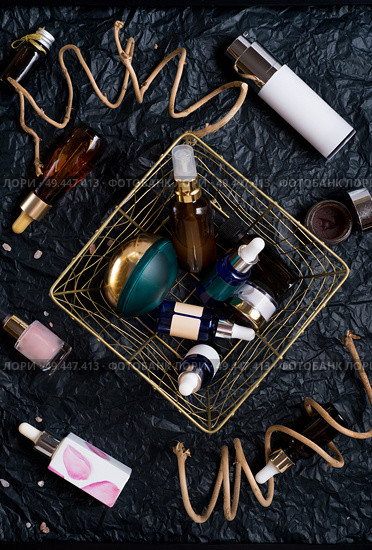 set of nature precious oils and  care cosmetics on black background . Стоковое фото, агентство Ingram Publishing / Фотобанк Лори