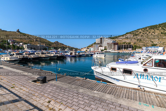 Sevastopol, Crimea - July 3. 2019. Boat in the Balaklava Bay. Редакционное фото, фотограф Володина Ольга / Фотобанк Лори