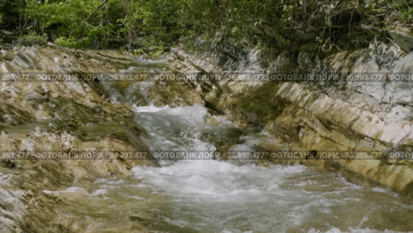 Северный Кавказ. Горная река Жане весной. The North Caucasus. Mountain river Zhane in the springtime. Стоковое видео, видеограф Евгений Романов / Фотобанк Лори