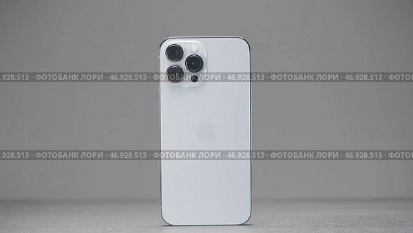Shenzhen - China, 10.16.2021: iPhone 13 Pro Max with three cameras in silver color. Редакционное фото, фотограф David Kashakhi / Фотобанк Лори