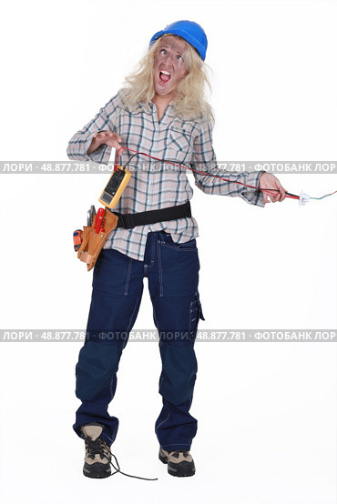 Shocked female electrician. Стоковое фото, агентство Ingram Publishing / Фотобанк Лори