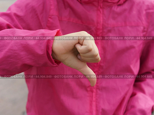 Sign language. Thumb down. Стоковое фото, фотограф YuryKara / Фотобанк Лори