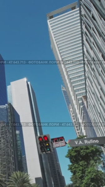 Skyscrapers soar in urban cityscape. Стоковое видео, видеограф Михаил Коханчиков / Фотобанк Лори