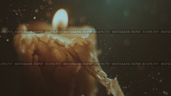 Soft glow of a candle illuminates a room as wax drips slowly at night. Стоковое AI-видео, аниматор Сергей Толмачёв / Фотобанк Лори