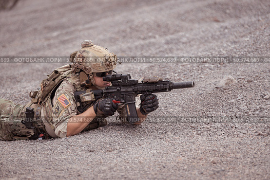 Soldiers in camouflage military uniforms carrying weapons, Reconnaissance missions in rugged mountains, Assault infantry battle training. Стоковое фото, агентство Ingram Publishing / Фотобанк Лори
