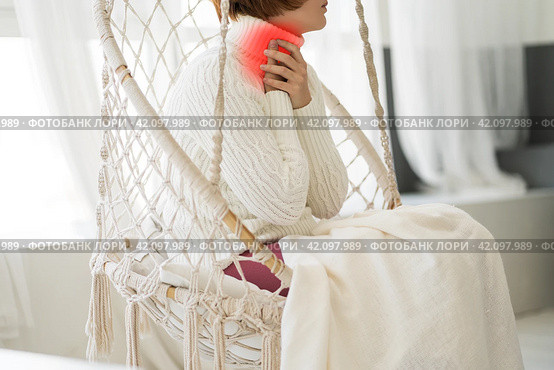 Sore throat and cough, woman with pain in neck at home. Стоковое фото, фотограф Станислав Тарко / Фотобанк Лори