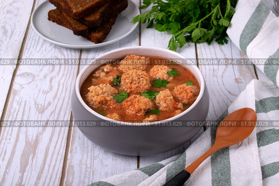 Soup with haddock fish balls in a gray bowl on white table. Стоковое фото, фотограф Оксана Чаюн / Фотобанк Лори