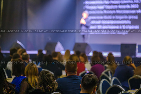 Speaker addressing audience at business conference with stage presentation. Стоковое фото, фотограф Антон Гвоздиков / Фотобанк Лори