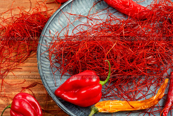 Spicy seasoning, spice, cut from red pepper. Thinly sliced pepper.. Hot red pepper spice. Стоковое фото, агентство Ingram Publishing / Фотобанк Лори