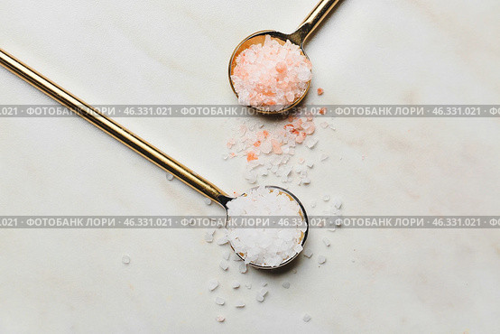 Spoons with different salt on white background. Стоковое фото, фотограф Pixel_shot / Фотобанк Лори