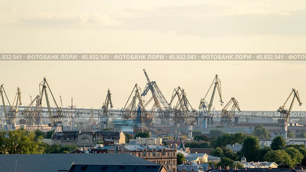 St. Petersburg, Russia, September 04, 2024: St. Petersburg roofs and shipyards top view. Редакционное фото, фотограф Igor Skripachev / Фотобанк Лори
