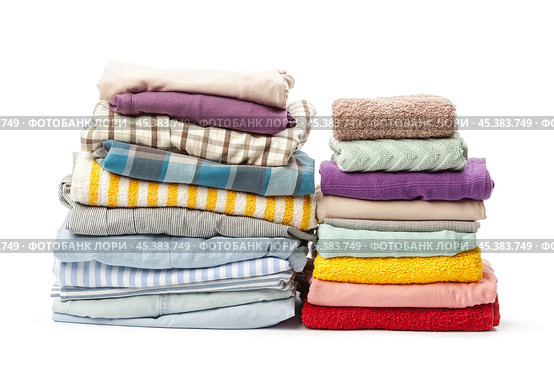 stack of clothing isolated on white. Стоковое фото, фотограф Сергей Толмачёв / Фотобанк Лори