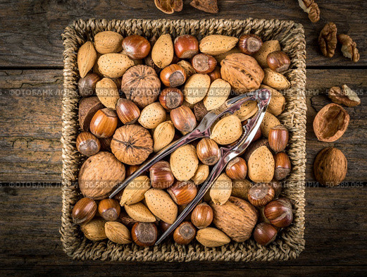 steel nutcracker and nuts of various kinds. Стоковое фото, агентство Ingram Publishing / Фотобанк Лори