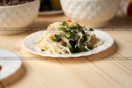 Stewed cabbage quiet conversation with God Stewed cabbage on a wooden background symbolizes quiet conversation with God, which takes place through prayer and reading Word during the days of fasting. Стоковое фото, фотограф Скрипачев Антон / Фотобанк Лори