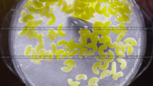 Stirring the paste with an iron spoon in a glass bowl. Bottom view. Стоковое видео, видеограф Юрий Поздников / Фотобанк Лори