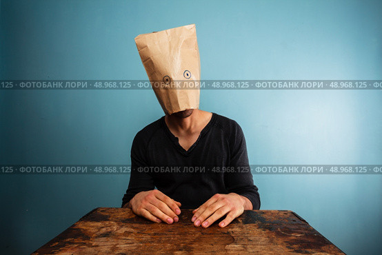 Strange man with a paper bag over his head. Стоковое фото, агентство Ingram Publishing / Фотобанк Лори